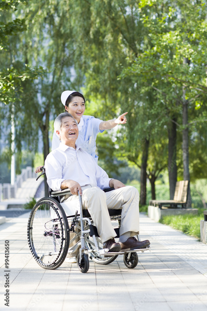 Nurse with wheelchair bound patient Nurse with wheelchair bound patient