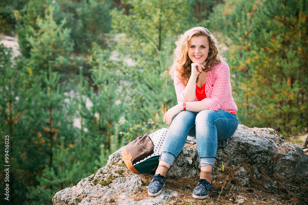 Beautiful Plus Size Young Smiling Woman Sitting on Stone inSumme Beautiful Plus Size Young Smiling Woman Sitting on Stone inSumme