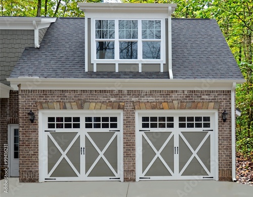 Double door garage at the entry of a new modern home.