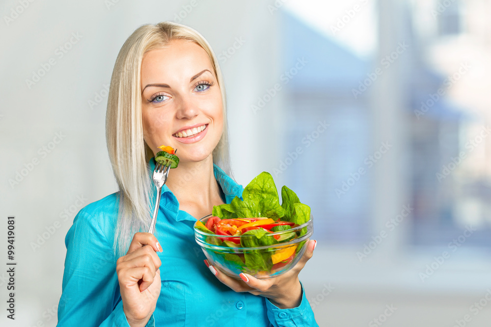 Beautiful girl eating fresh vegetable salad Beautiful girl eating fresh vegetable salad