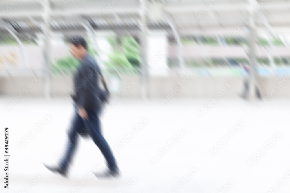 Fototapeta premium motion blur business man walking to work