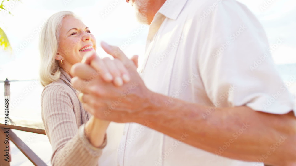 Retired Caucasian couple evening dancing together at a vacation hotel Retired Caucasian couple evening dancing together at a vacation hotel