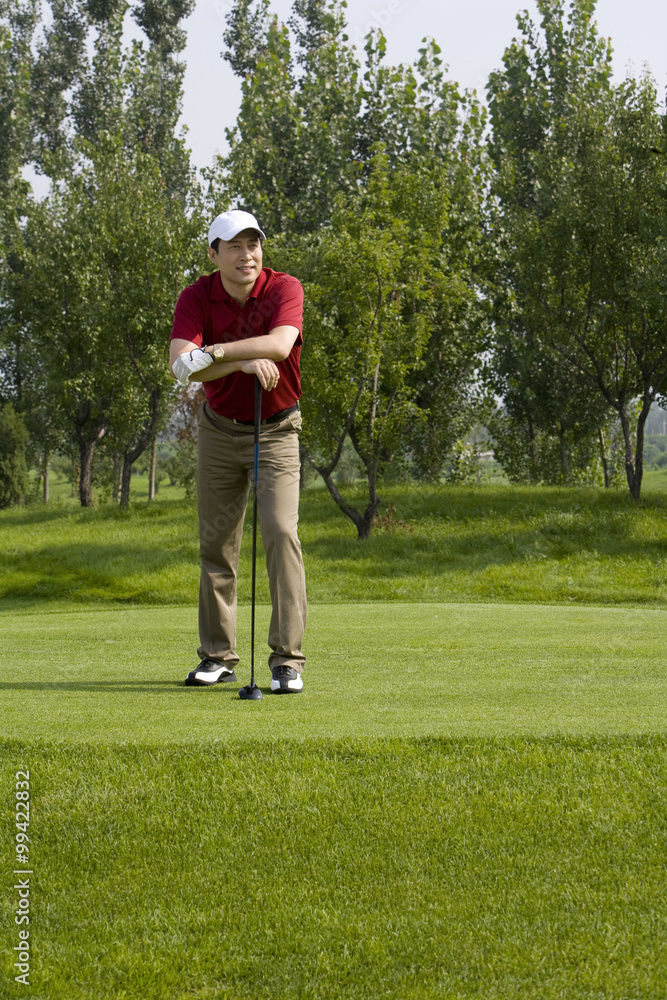 Obraz premium Portrait of a male golfer on the course
