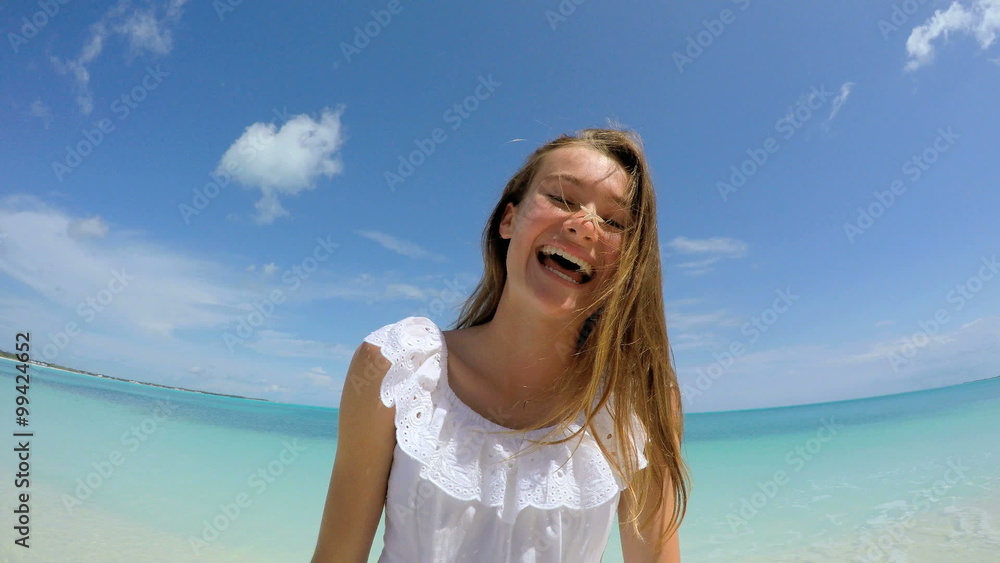 Portrait of smiling young Caucasian girl on tropical beach Portrait of smiling young Caucasian girl on tropical beach