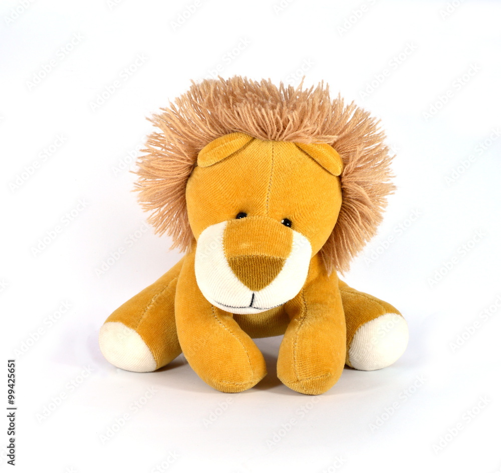 Naklejka premium Plush Lion looking at the camera on a white background