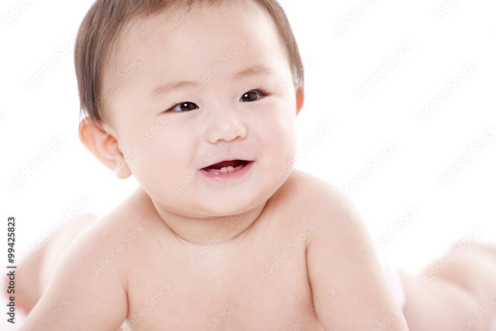 Studio shot of cute baby lying on floor Studio shot of cute baby lying on floor