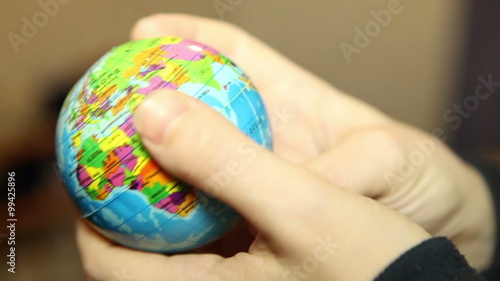 Wallpaper Mural small globe in the hands of women Torontodigital.ca