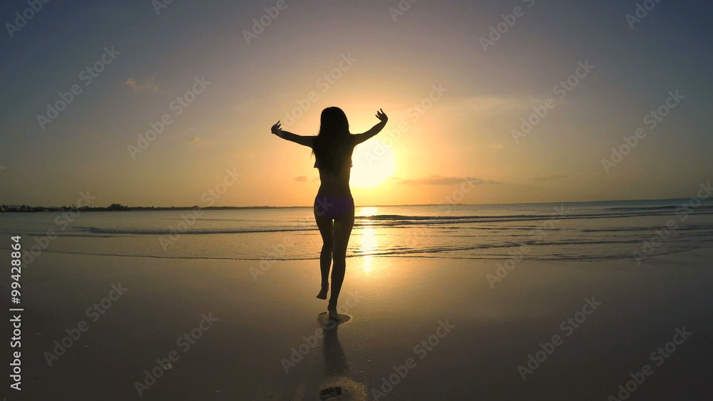 Young Asian Chinese girl in swimwear on the ocean beach Young Asian Chinese girl in swimwear on the ocean beach