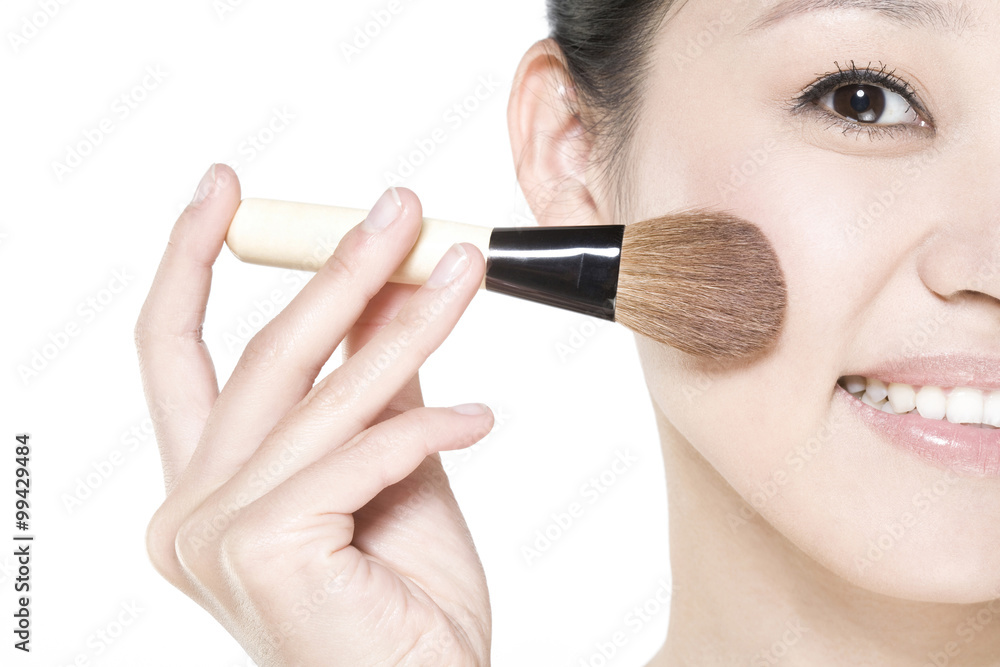 Young woman with a blusher Young woman with a blusher