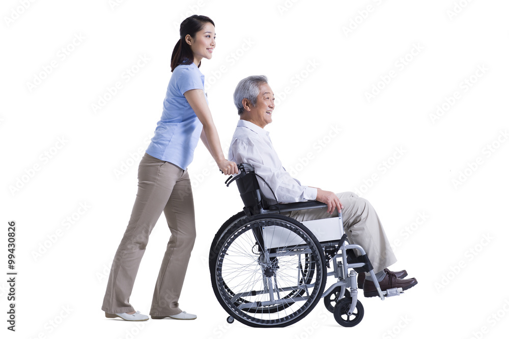 Female nursing assistant taking care of senior in wheelchair Female nursing assistant taking care of senior in wheelchair
