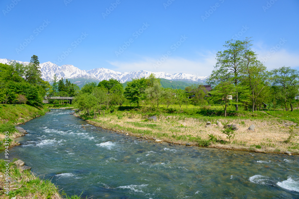 Shirouma mountains and Himekawa river at Ooide park in Hakuba, Nagano, Japan Shirouma mountains and Himekawa river at Ooide park in Hakuba, Nagano, Japan