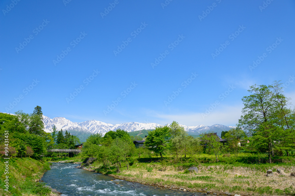 Shirouma mountains and Himekawa river at Ooide park in Hakuba, Nagano, Japan Shirouma mountains and Himekawa river at Ooide park in Hakuba, Nagano, Japan