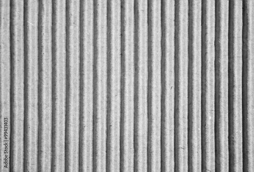 Cardboard paper background bright vertical corrugated strips