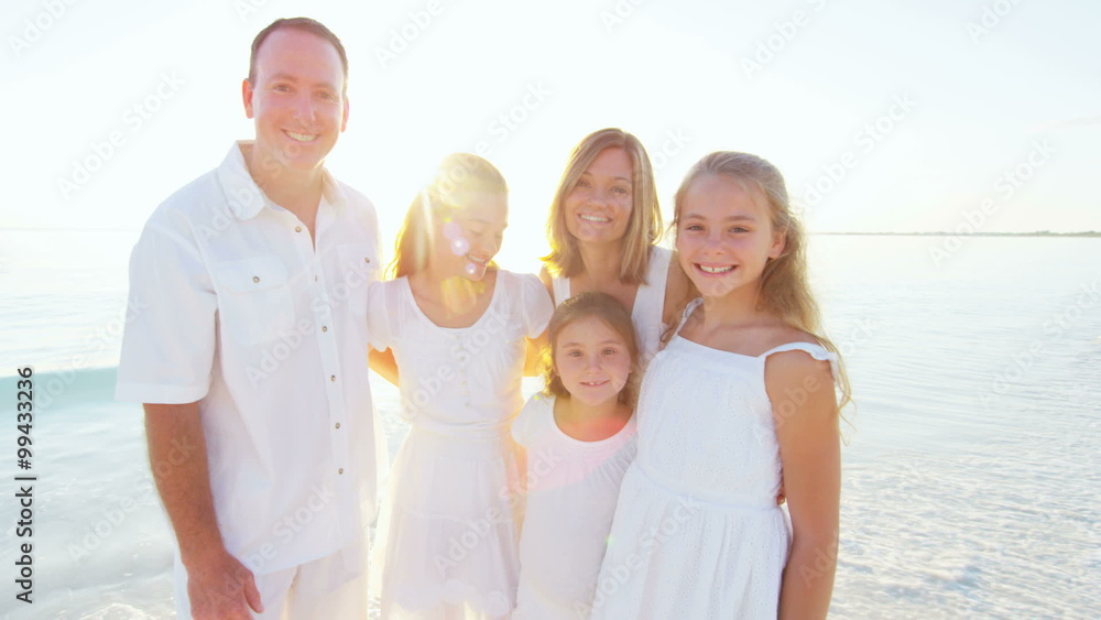 Portrait of a young Caucasian family on a beach Portrait of a young Caucasian family on a beach