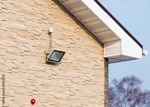 Fotografija LED floodlight on wall of house.