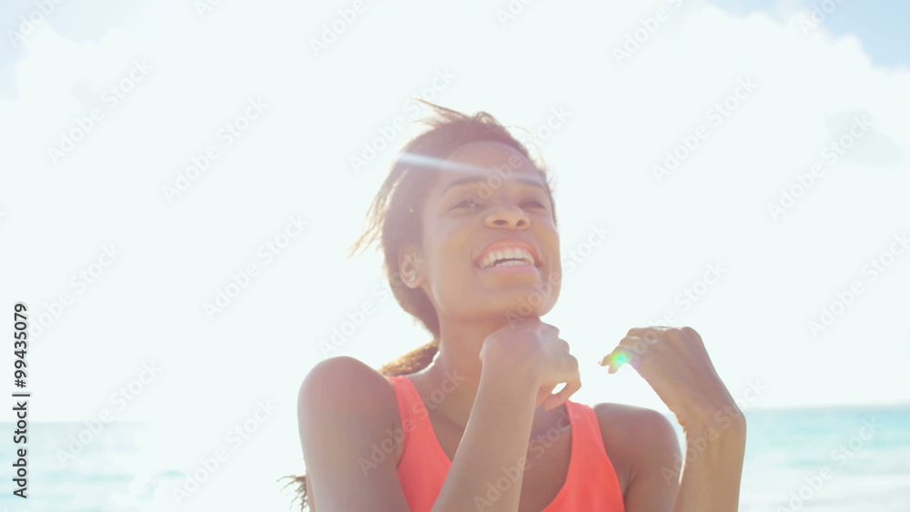 Leisure lifestyle of ethnic African American female on ocean beach Leisure lifestyle of ethnic African American female on ocean beach