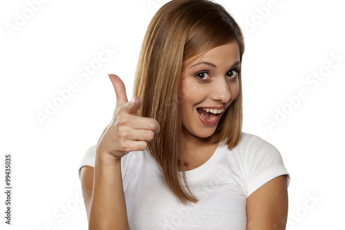 Wallpaper Mural happy young woman showing thumbs up Torontodigital.ca