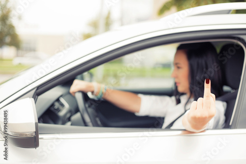 Billede på lærred Female driver flipping off someone