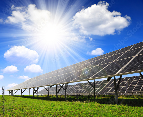 Solar panels against sunny sky. Clean energy.