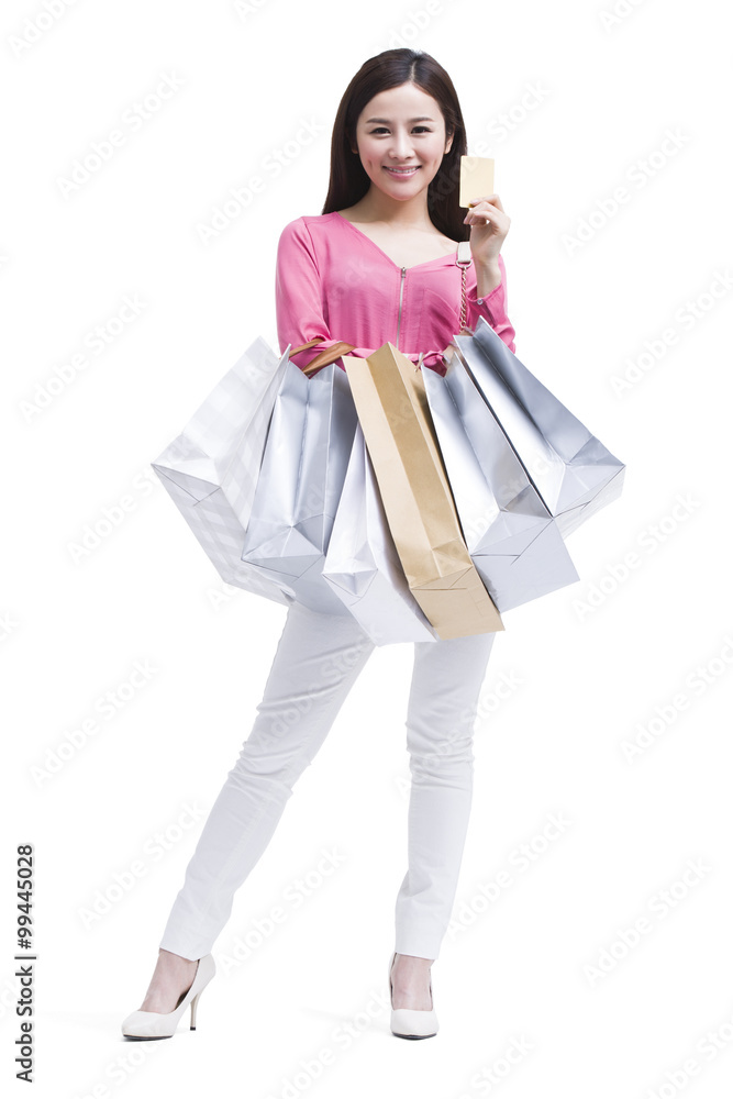 Cheerful young woman shopping with credit card Cheerful young woman shopping with credit card