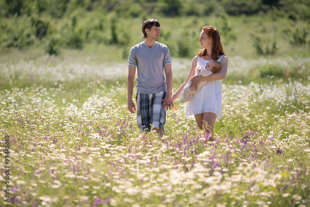 Fototapeta premium Young family on field