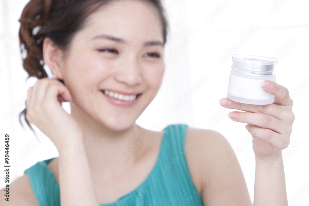 Beautiful young woman with skincare products Beautiful young woman with skincare products