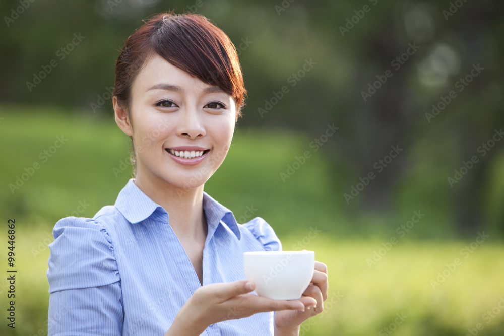Young Woman Drinking Coffee Outdoors Young Woman Drinking Coffee Outdoors