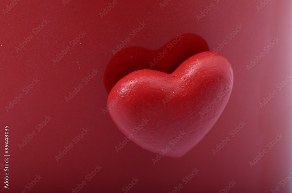 Red heart on red background Red heart on red background