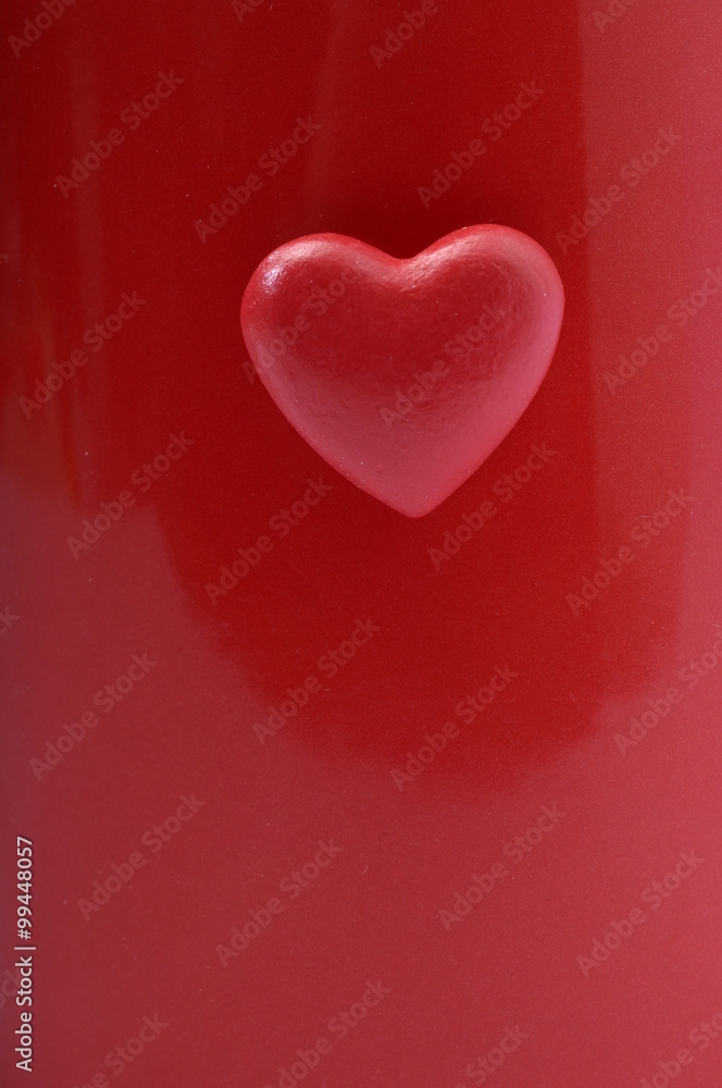 Red heart on red background