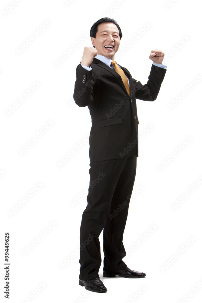 Excited senior businessman punching the air Excited senior businessman punching the air