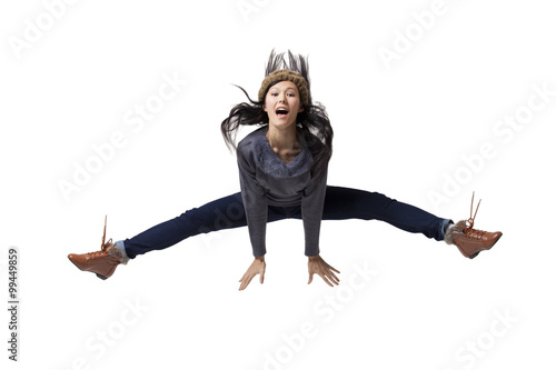 Tablou pe pânză Young woman jumping in mid-air