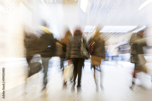 Photography Crowd of people rushing through corridor, zoom effect, motion bl