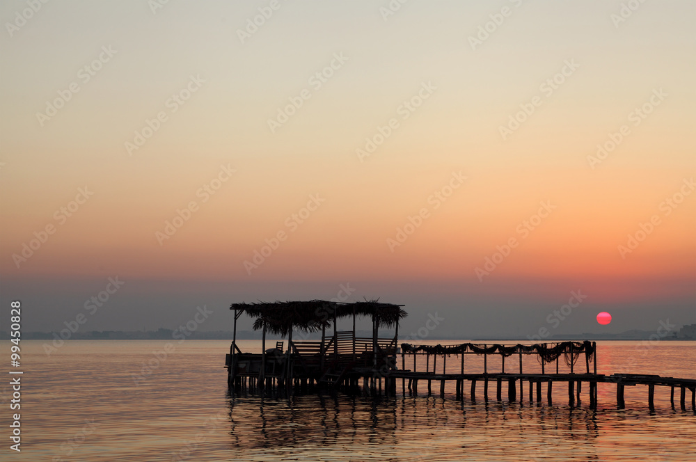 Extended wooden platform during sunrise Extended wooden platform during sunrise