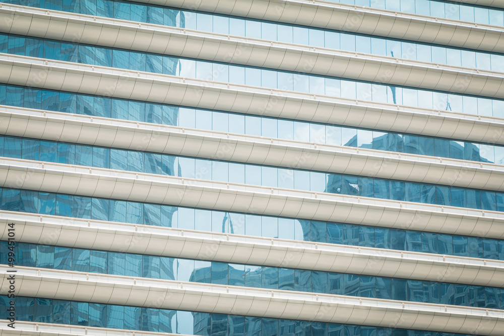 Obraz premium Buildings reflected in windows of modern office building