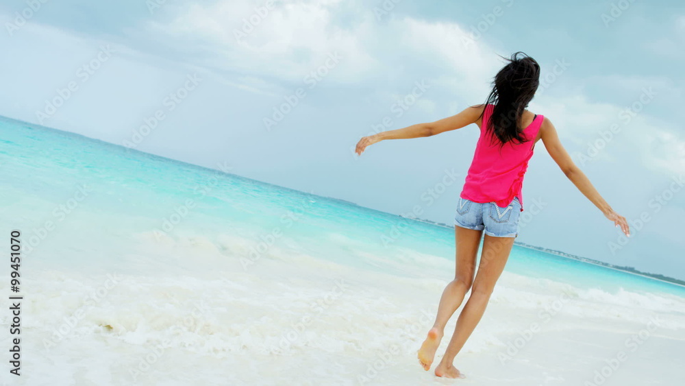 Ethnic African American female carefree on ocean beach Ethnic African American female carefree on ocean beach