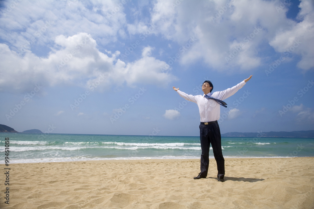 Businessman excited to be on the beach Businessman excited to be on the beach