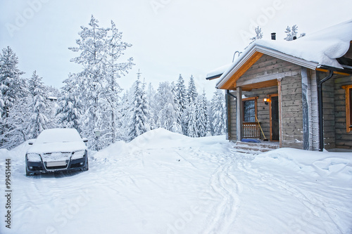 Car parked at a Wooden Cottage in Ruka in Finland in the Arctic circle