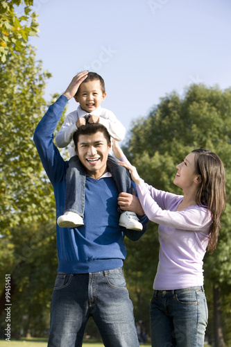 Portrait of young family at the park