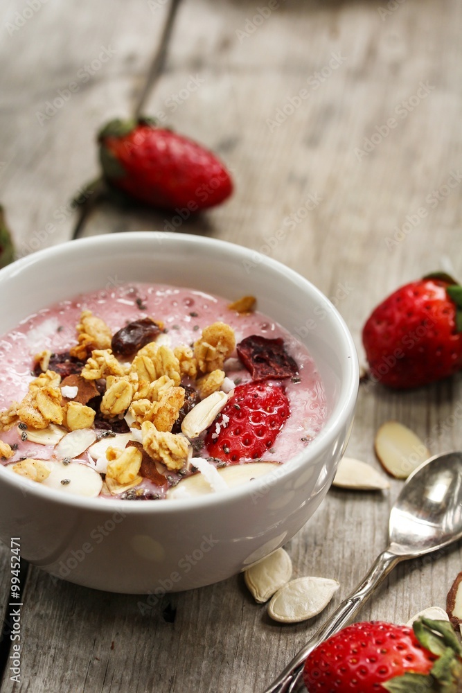 Breakfast smoothie bowl with strawberries granola nuts and Chia seeds Breakfast smoothie bowl with strawberries granola nuts and Chia seeds