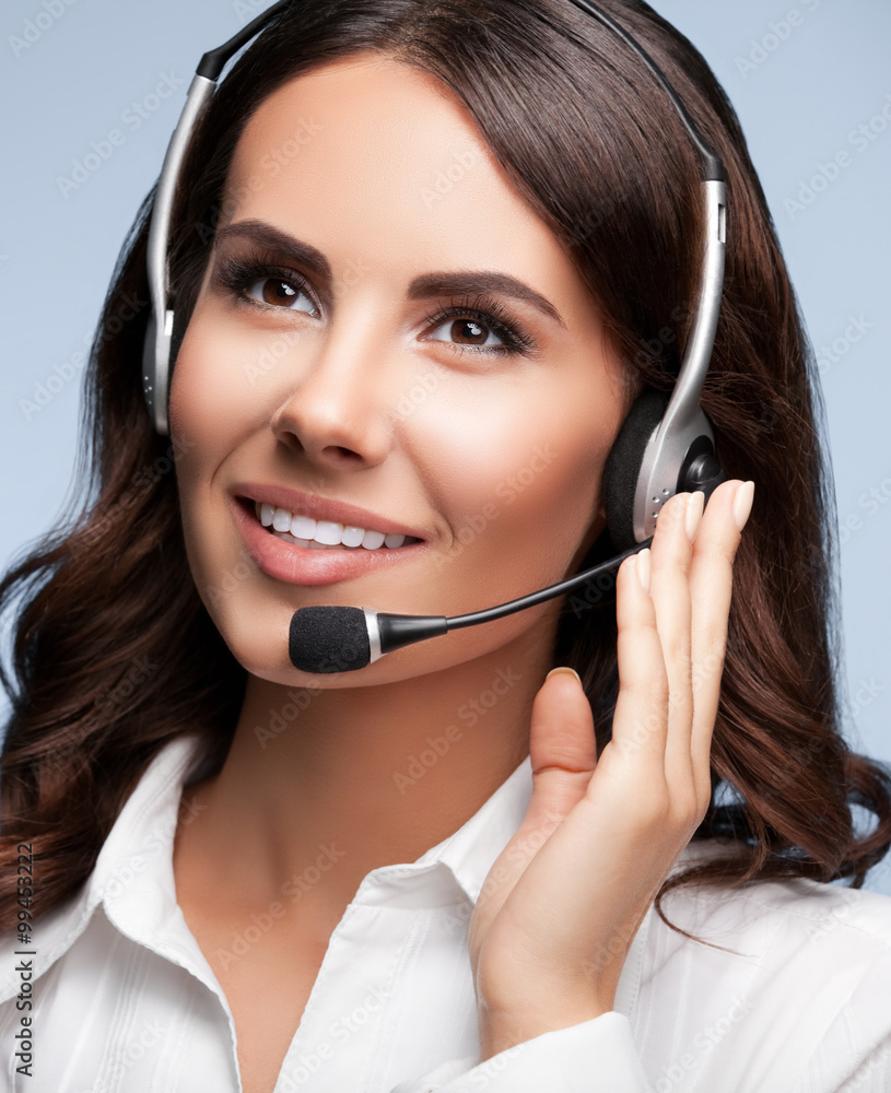 Portrait of cheerful support female phone operator in headset, a Portrait of cheerful support female phone operator in headset, a