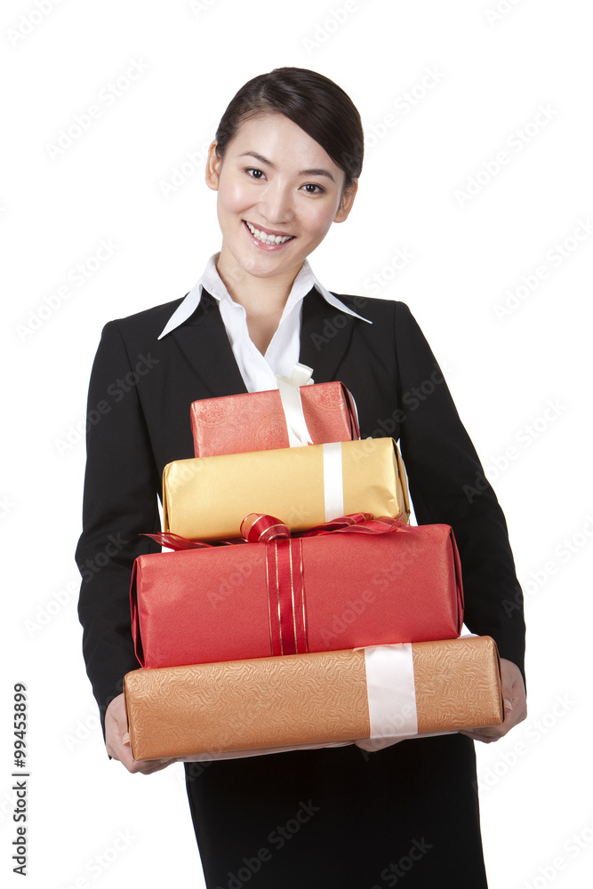 Happy Businesswoman Holding a Stack of Gifts Happy Businesswoman Holding a Stack of Gifts