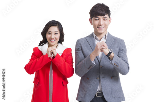 Happy young couple greeting for Chinese New Year