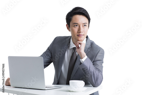 Male office worker working with laptop