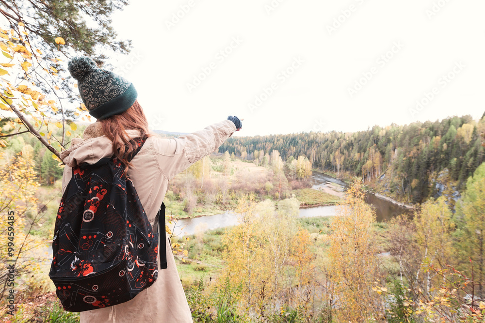 Young woman traveling in the forest. Indicates hand path Young woman traveling in the forest. Indicates hand path