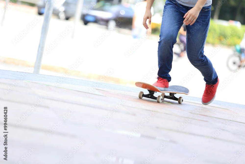 young skateboarder legs riding on skateboard on city young skateboarder legs riding on skateboard on city