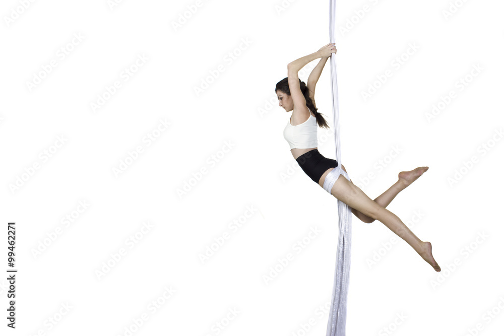 Athletic woman doing some tricks on silks Athletic woman doing some tricks on silks