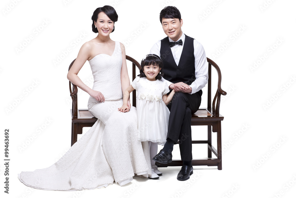 Happy young family sitting in chairs