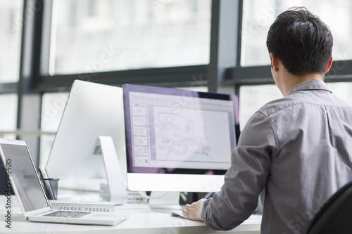 Young businessman using computer in office © Blue Jean Images