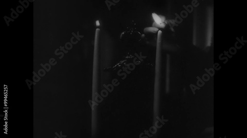 Medium shot of woman lighting candles photo