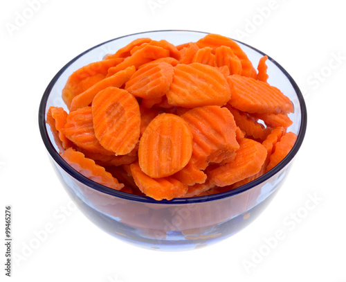 Bowl filled with carrot chips on white background